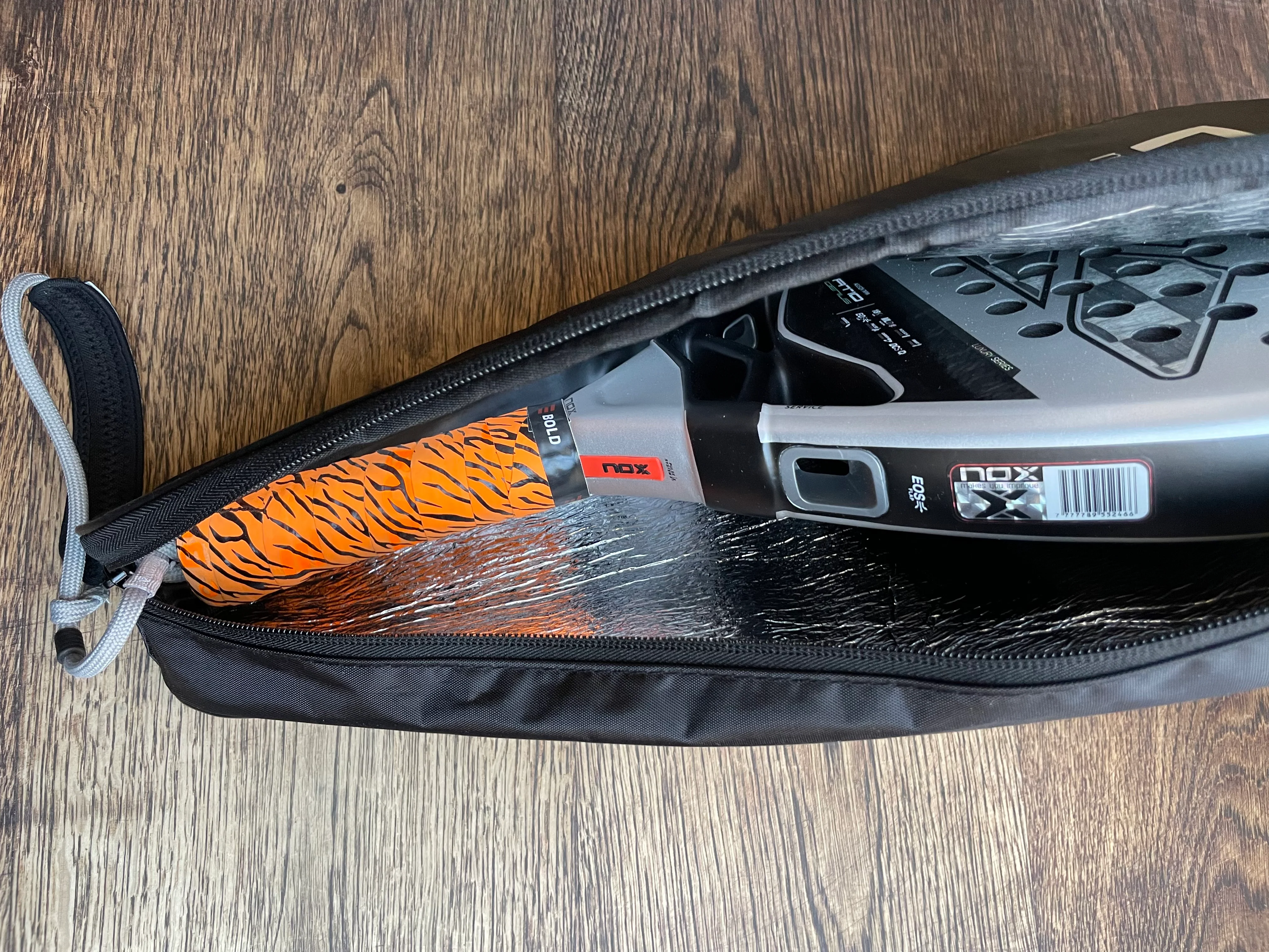 A padel racket stored safely inside a protective padel bag
